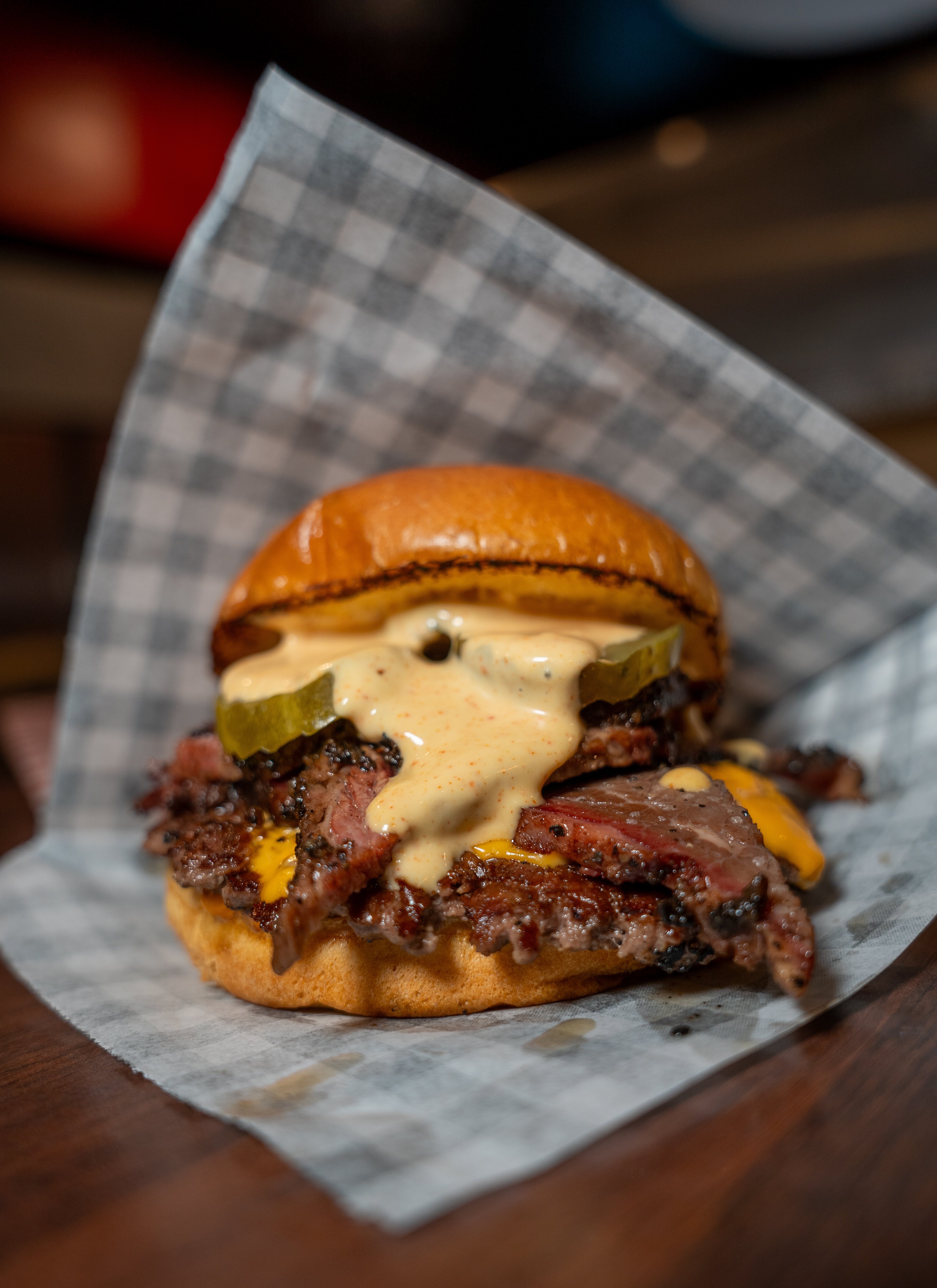 Simply Smashed signature halal wagyu burger with crispy edges, melted American cheese, and house-made sauce on a toasted bun - London's highest-rated burger from Stepney Green
